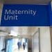 Blue sign saying Maternity Unit in a hospital corridor
