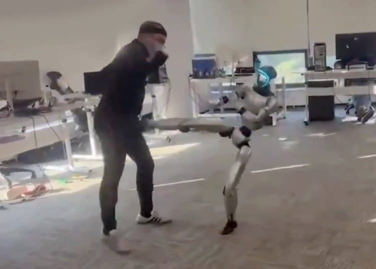 Motion controlled robot kicking the man controlling it in balls