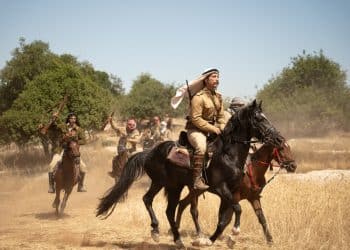 Film still from Palestine 36, showing men on horseback
