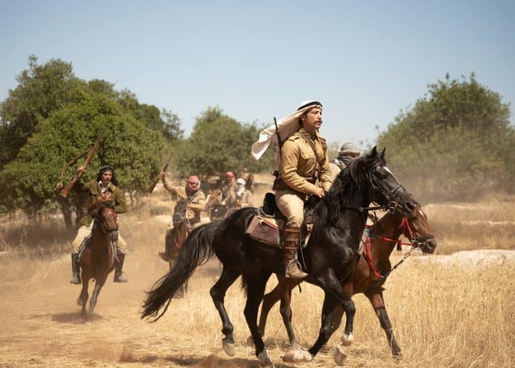 Film still from Palestine 36, showing men on horseback