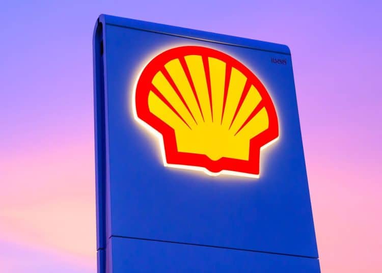 Shell logo on a sign against a sunset