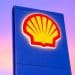 Shell logo on a sign against a sunset