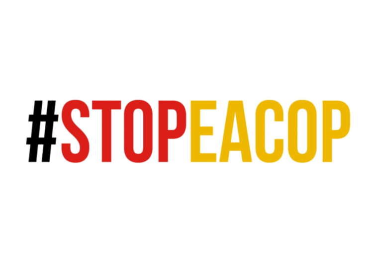 Red and yellow text reading hashtag STOPEACOP, a slogan against the East African Crude Oil Pipeline