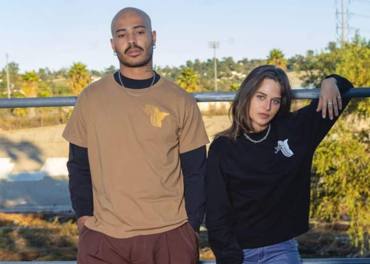 Two models wearing Gaza Sunbirds cycling team t-shirts
