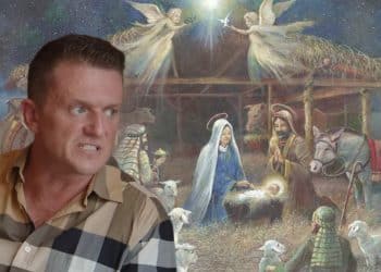 Tommy Robinson in front of a nativity scene
