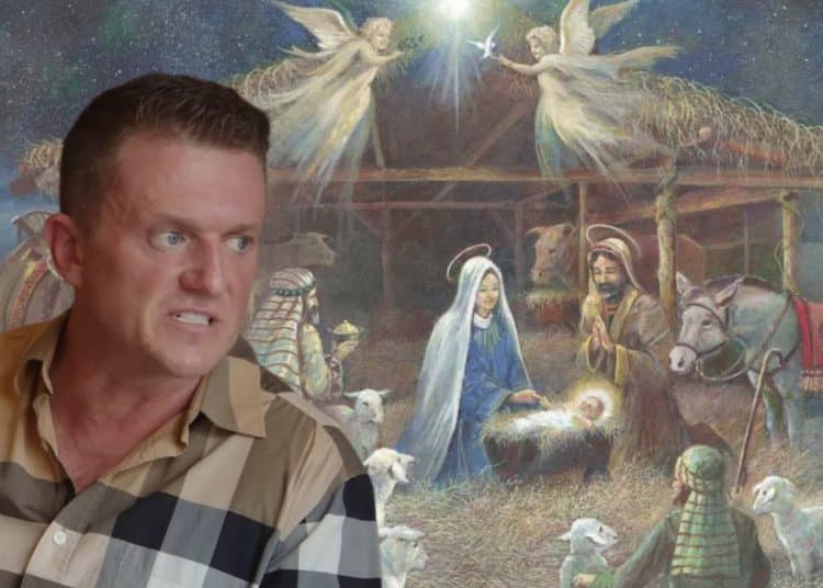 Tommy Robinson in front of a nativity scene