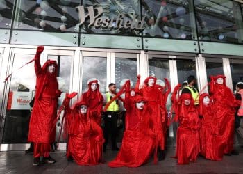 Extinction Rebellion's Red Rebels in front of Westfield shopping centre