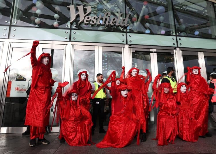 Extinction Rebellion's Red Rebels in front of Westfield shopping centre