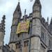 Church of England Bath Abbey with banner hanging from tower that says Don't Crucify Creation