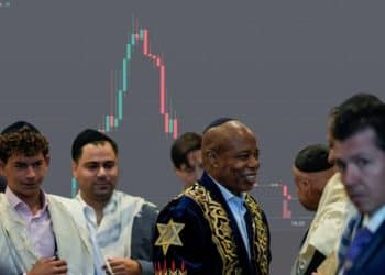 former NYC mayor Eric Adams in Jewish robes in front of a crypto value tracker 2