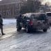 ICE agents surround a vehicle
