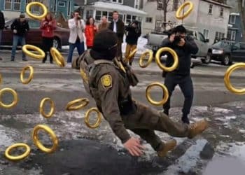 Image of an ICE agent falling over