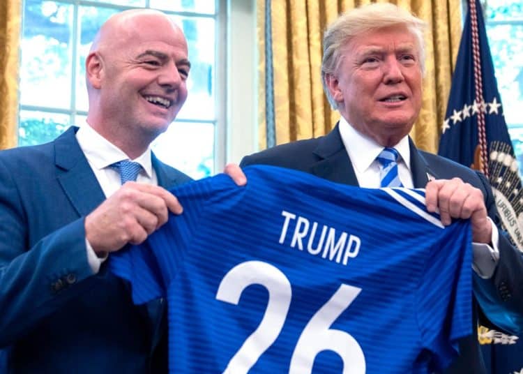FIFA president Gianni Infantino and Donald Trump holding a football shirt saying Trump 26 to promote the 2026 World Cup