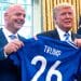 FIFA president Gianni Infantino and Donald Trump holding a football shirt saying Trump 26 to promote the 2026 World Cup