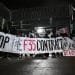 Protesters outside Leonardo arms factory Edinburgh holding banner saying Stop The F35 Contract