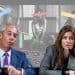 Nigel Farage and Laila Cunningham in front of images of censored women Reform