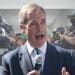 Nigel Farage in front of a lineup of ICE officers