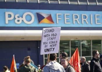 Protest in support of sacked seafarers in front of a P&O Ferries sign