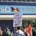 Protest in support of sacked seafarers in front of a P&O Ferries sign
