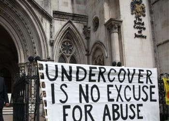 Spycops - A banner outside the Royal Courts Of Justice reads Undercover Is No Excuse For Abuse