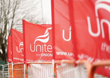 Unite the Union flags fly on a picket line
