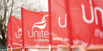 Unite the Union flags fly on a picket line