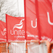 Unite the Union flags fly on a picket line