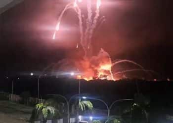 Distant explosions light up the night sky during US attack on Venezuela