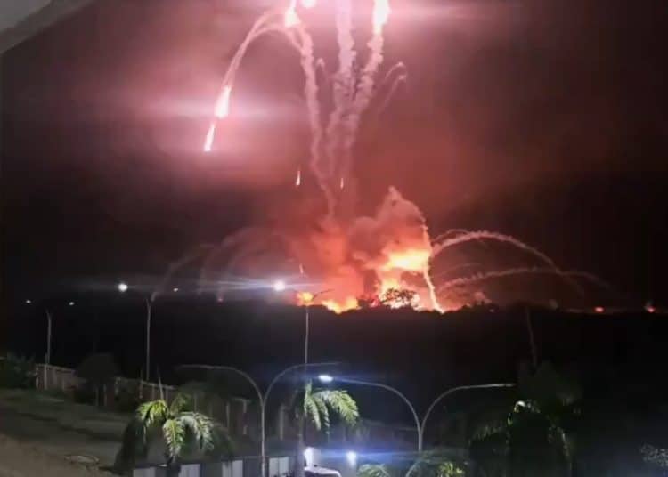 Distant explosions light up the night sky during US attack on Venezuela