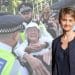 Yvette Cooper in front of an image of the police arresting an elderly protester