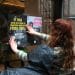 Campaigners flyposting at an office of Zurich Insurance Group