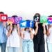 Stock image of children with their faces hidden by logos of social media platforms