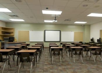 Austere classroom illustrating autistic children's school difficulties