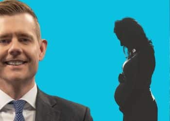 Matt Goodwin in front of a pregnant woman