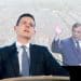 Image of Matt Goodwin with Farage behind him waving