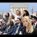 Epstein victims standing behind Pam Bondi