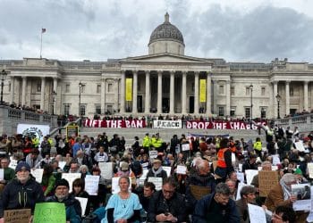 Defend Our Juries protest in Trafalgar Square. Banner reads Lift The Ban Peace Drop The Charges Unity Against Genocide