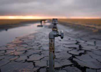 A water tap stands in a drought-affected landscape Nature security assessment