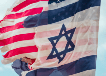 The Israel and US flags fly next to one another