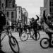 Young people on bicycles in street, illustrating Manchester Resist Britain First action