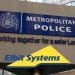 Elbit Systems logo over Met Police sign
