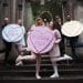 Protesters against Rosebank oil field hold giant love hearts saying Hot Earth, Rosebank Kills, Save Me