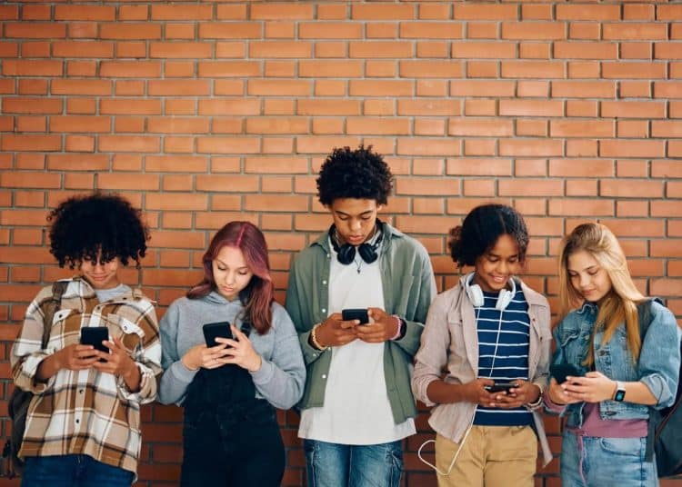 Young people looking at phones
