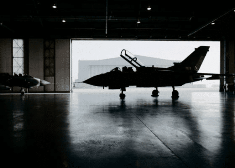 Military spending - an aircraft is stationary in an airplane hangar