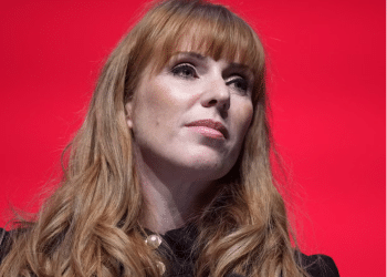 Angela Rayner head shot with her signature long ginger hair curled at the ends