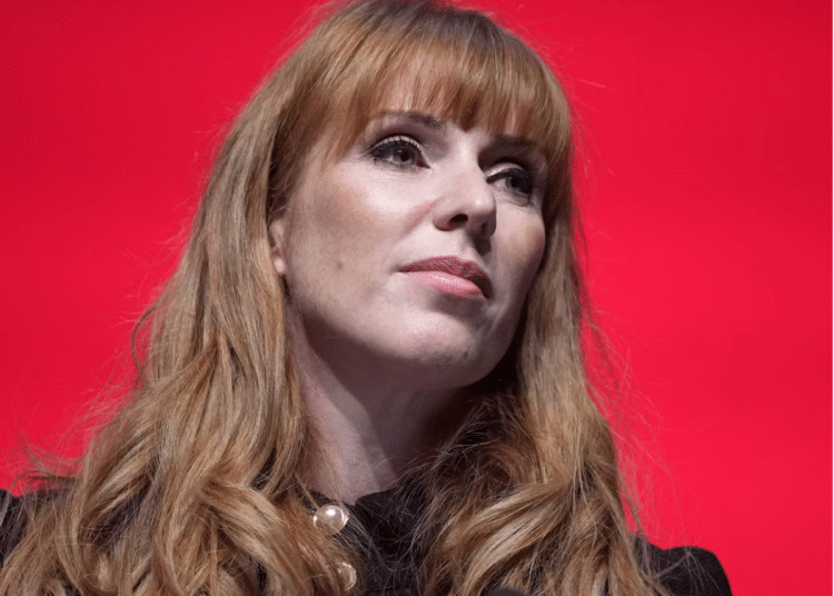 Angela Rayner head shot with her signature long ginger hair curled at the ends