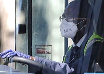 Bus driver wearing covid mask, gloves TUC pandemic planning