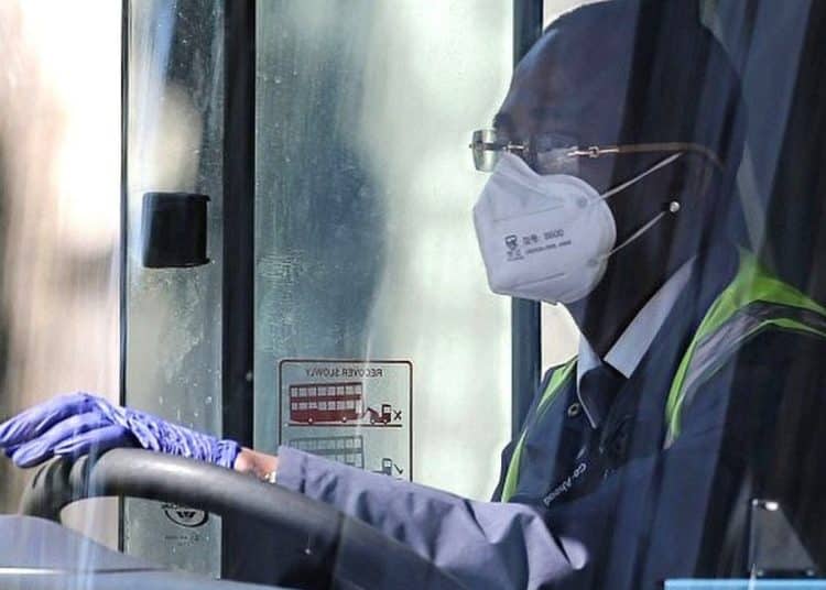 Bus driver wearing covid mask, gloves TUC pandemic planning