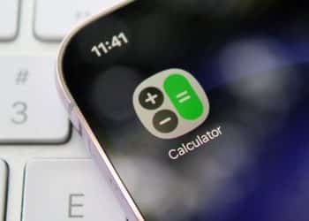 Image showing calculator app on mobile phone Financial education