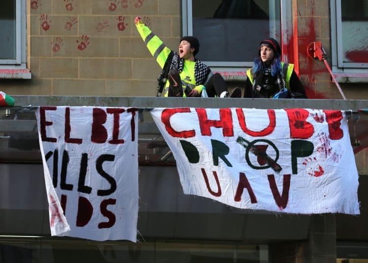 Protest at Manchester office of Chubb Insurance Signs read Elbit Kills Kids and Chubb Drop UAV